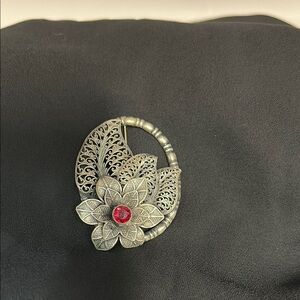 Elegant Silver Floral Brooch with Red Accent
